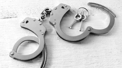Representational Image of handcuffs on the desk