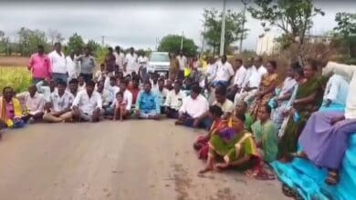 The image displays a picture of Hyderabad: Paddy farmers of Telangana staging a protest on Wednesday,