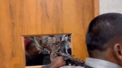 Security personnel of MLC Teenmaar Mallanna firing gunshots at agitating Telangana Jagruthi workers