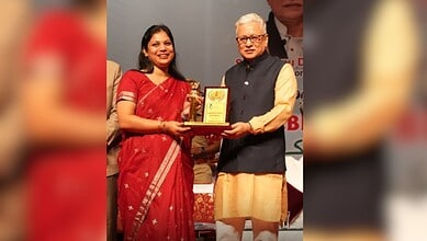 Telangana Governor Vishnu Dev Varma awards Karimnagar Collector Pamela Sathpathy for swift disposal of RTI pleas