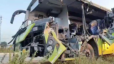 The bus is mangled after ramming lorry in Jangaon