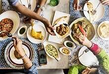top view of indian dining table with family sharing a meal
