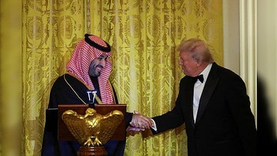 US President greets the Saudi Crown Prince during a White House dinner