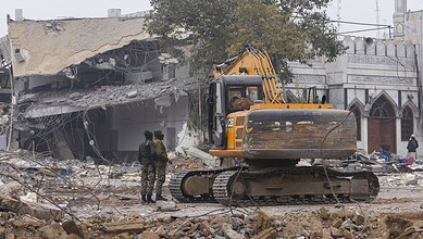 New Delhi: Men stand at the entrance of Syed Faiz Elahi mosque amid debris after demolition of alleged encroachments on land adjoining the mosque by the Municipal Corporation of Delhi