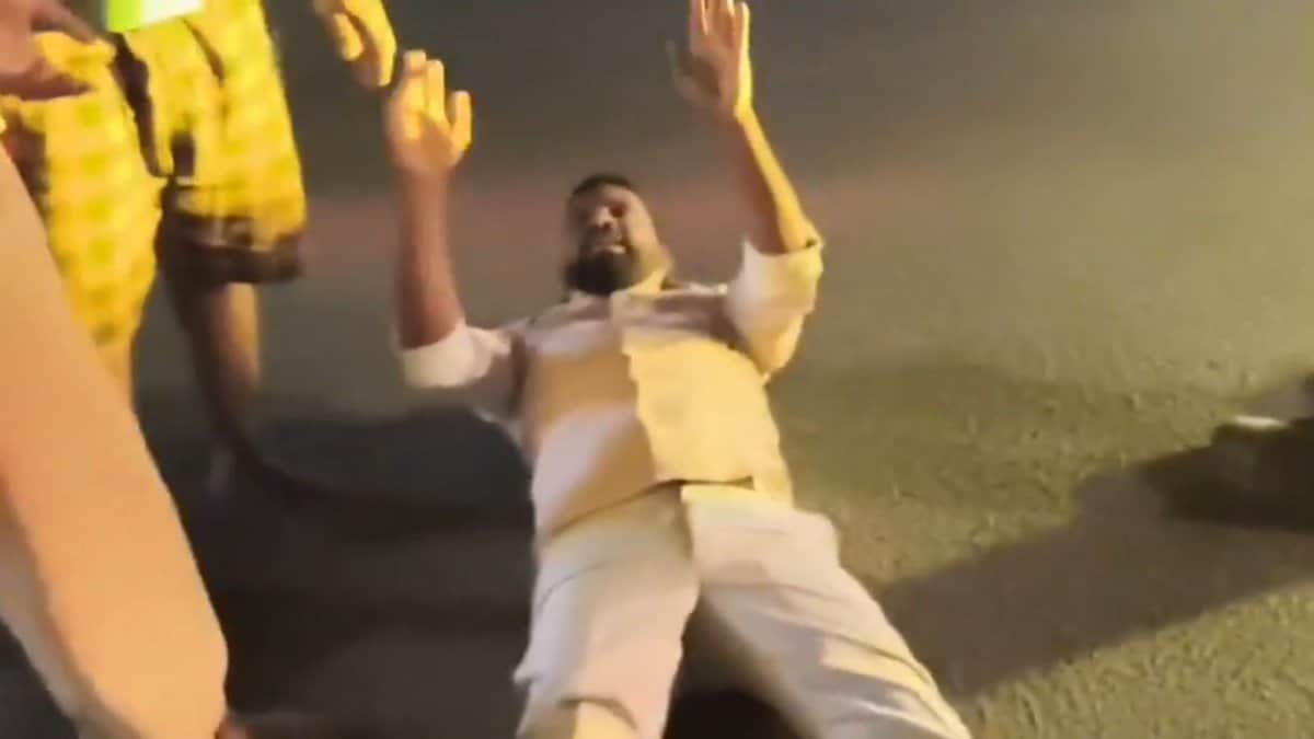 A man lies on the road in Hyderabad