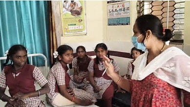 School girls in Telangana after food poisoning incident with a woman health educator.