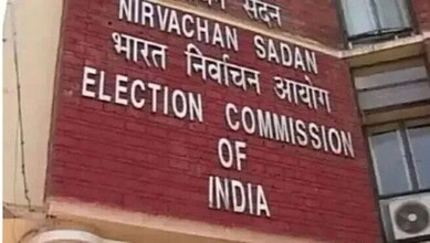 Election Commission of India sign on a brick wall.