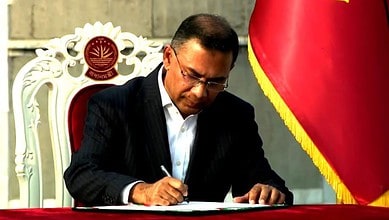 Tarique Rahman signing official documents during his swearing-in as Bangladesh's new Prime Minister.