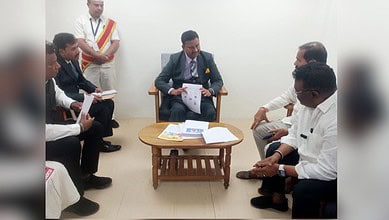 Officials discuss water and power restoration plans with Dalit families in Hanamkonda.