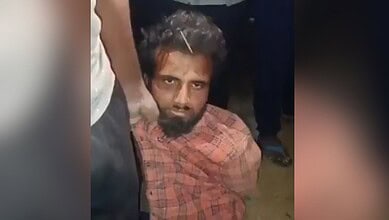 Man with mental health condition offering namaz at Hyderabad temple, surrounded by onlookers.