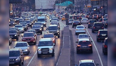 Traffic jam in Telangana with vehicles on the road, related to vehicle registration and road safety.
