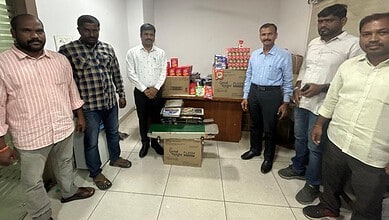 Hyderabad police display seized packets of counterfeit tea and detergent.