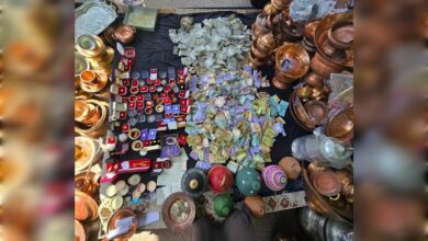 Pile of cash, jewellery and copper utensils collected as donations in Kashmir for Iran relief.