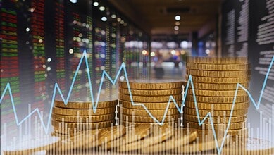 Stacked coins with stock market graph showing decline, reflecting foreign investor exit from Indian equit.