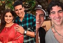 Young man with a necklace, smiling, in a casual setting.