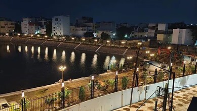 Hydraa team removing signage at Bathukamma Kunta site after Supreme Court order in Hyderabad.