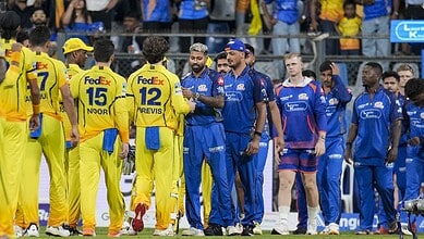 Sanju Samson and Akeal Hosein celebrate after CSK's 103-run win over MI in IPL.