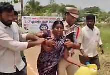 Woman attempting suicide over housing issue in Suryapet, surrounded by helpers.
