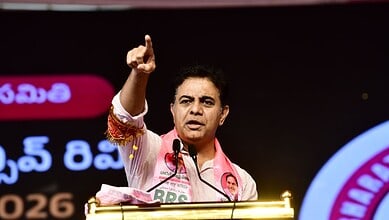 A woman speaking passionately at a podium during a political event, gesturing with her hand raised.