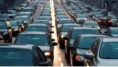 Traffic congestion on a busy Hyderabad road due to traffic restrictions ahead of PM Modi's visit.