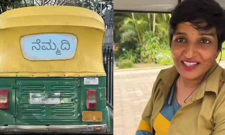 Auto rickshaw with Kannada sign on the back, and a smiling woman in a yellow and blue outfit outdoors.