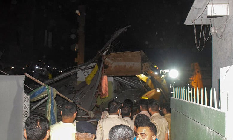 Police personnel at the collapsed site in Delhi