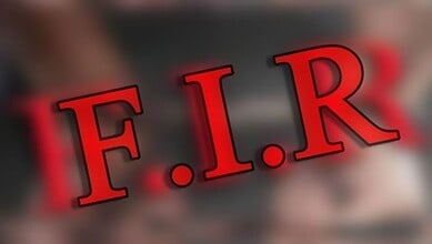 F.I.R. emergency fire response sign with bold red letters on a blurred background.