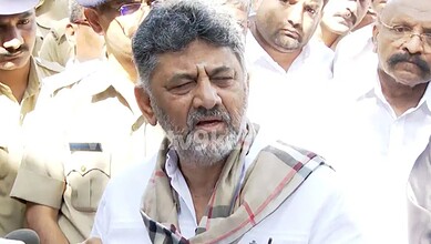 A man speaking passionately to a group of police officers and officials during a public event or protest.
