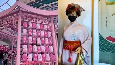 Display of pink Japanese-themed lanterns and a woman in traditional kimono at an event.