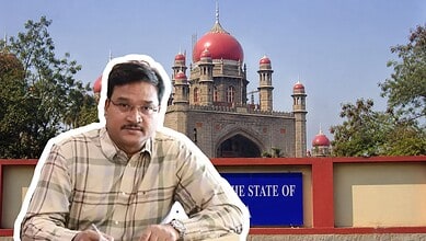 Man in front of historic red sandstone building with domes and minarets in India.