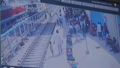 A boy walking with a stranger