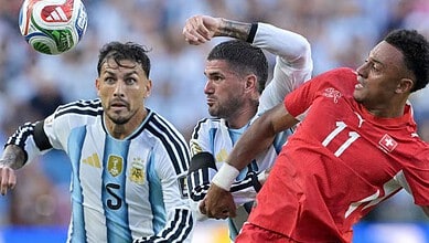 Argentina and Switzerland players jostle for the ball
