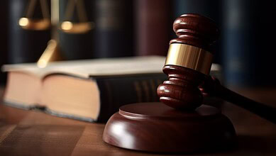 Gavel and law books symbolising justice and legal proceedings.