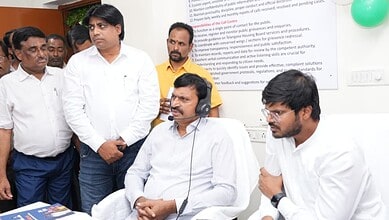 Officials and staff at a helpline launch event for Indiramma houses in Hyderabad.