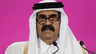 Qatar's former Emir honoured with a floral garland at a ceremony in Telangana.