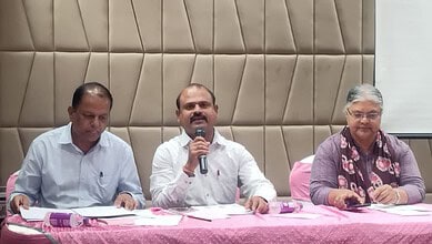 Panel discussion at workshop on safer migration of Indians to Saudi Arabia with speakers at a table.