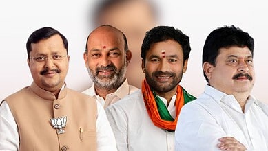 Indian political leaders at a public event, smiling and dressed in traditional attire.