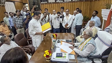 Prashant Kishor taking oath as Bihar MLA in a formal ceremony with officials and media present.
