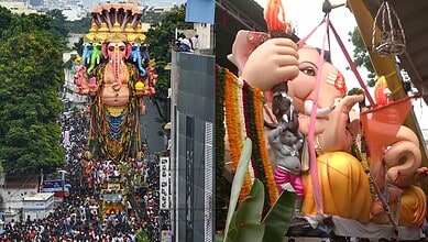 Large Ganesh idol being carried for immersion during Ganesh Chaturthi celebrations.