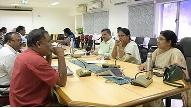 Officials discuss complaints during a meeting at GHMC and CMC offices.
