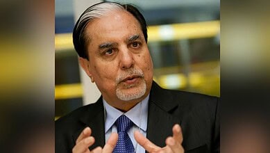 Subhash Chandra speaking at a press conference or event.