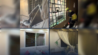 Rescue workers inspect damage after missile attack at Saudi Aramco building in Riyadh.