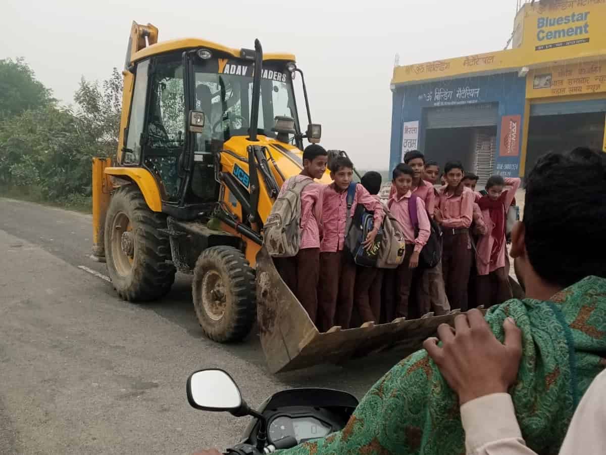Children travel in tractor trolley to school in UP