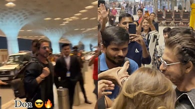 SRK all smiles as he appears at Mumbai airport, shakes hands with fan