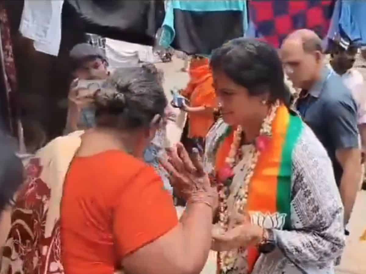Woman pushes BJP Hyderabad MP candidate during campaigning