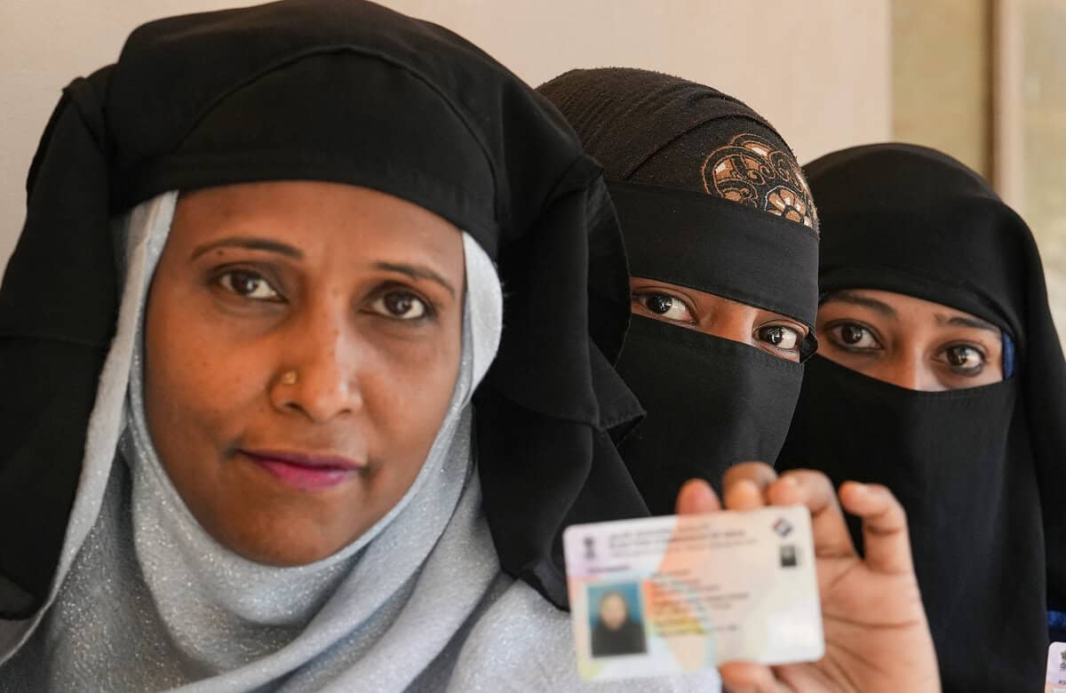 Burqa clad woman at a polling station