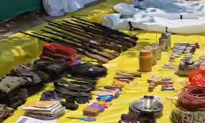 Arms and other items recovered by security personnel during an encounter with naxalites, in Bijapur district, Friday, May 10, 2024. At least 12 naxalites were killed, according to officials. (PTI Photo)