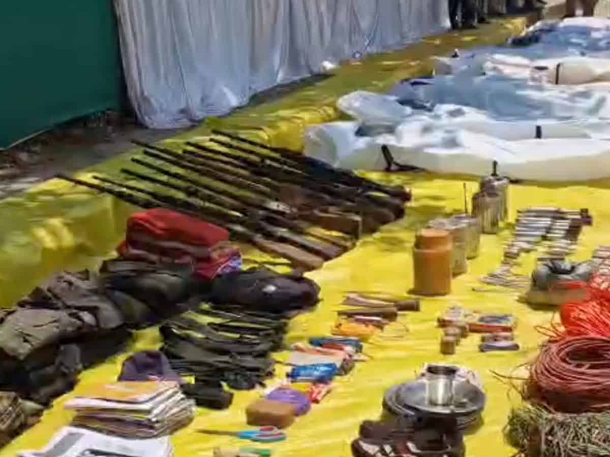 Arms and other items recovered by security personnel during an encounter with naxalites, in Bijapur district, Friday, May 10, 2024. At least 12 naxalites were killed, according to officials. (PTI Photo)