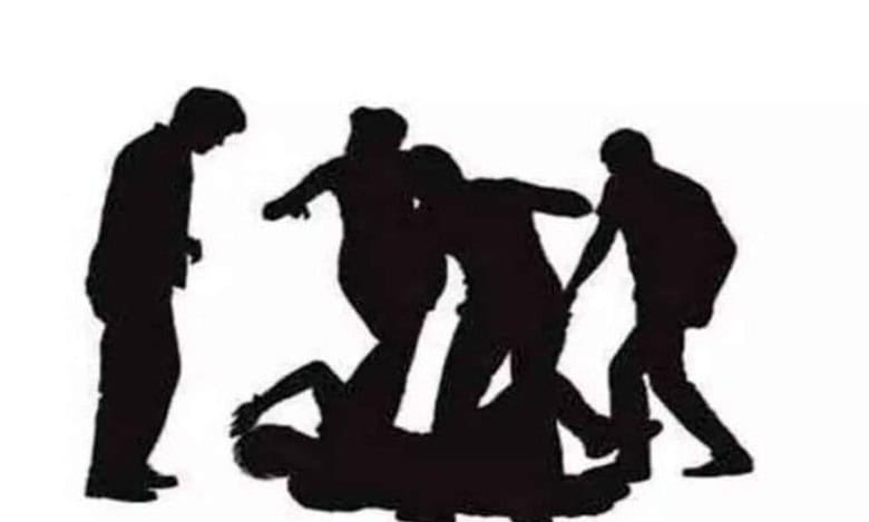 Representational Image of group of people thrashing a man