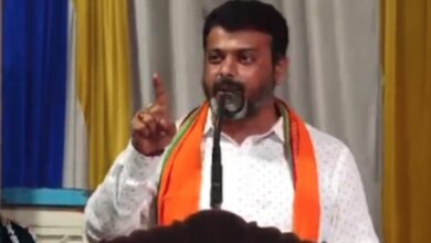 The image displays a picture of BJP MLA of Belthangady, Harish Poonja speaking at a religious ceremony at the Gopalakrishna Temple in Thekkaru village, Dakshina Kannada district.